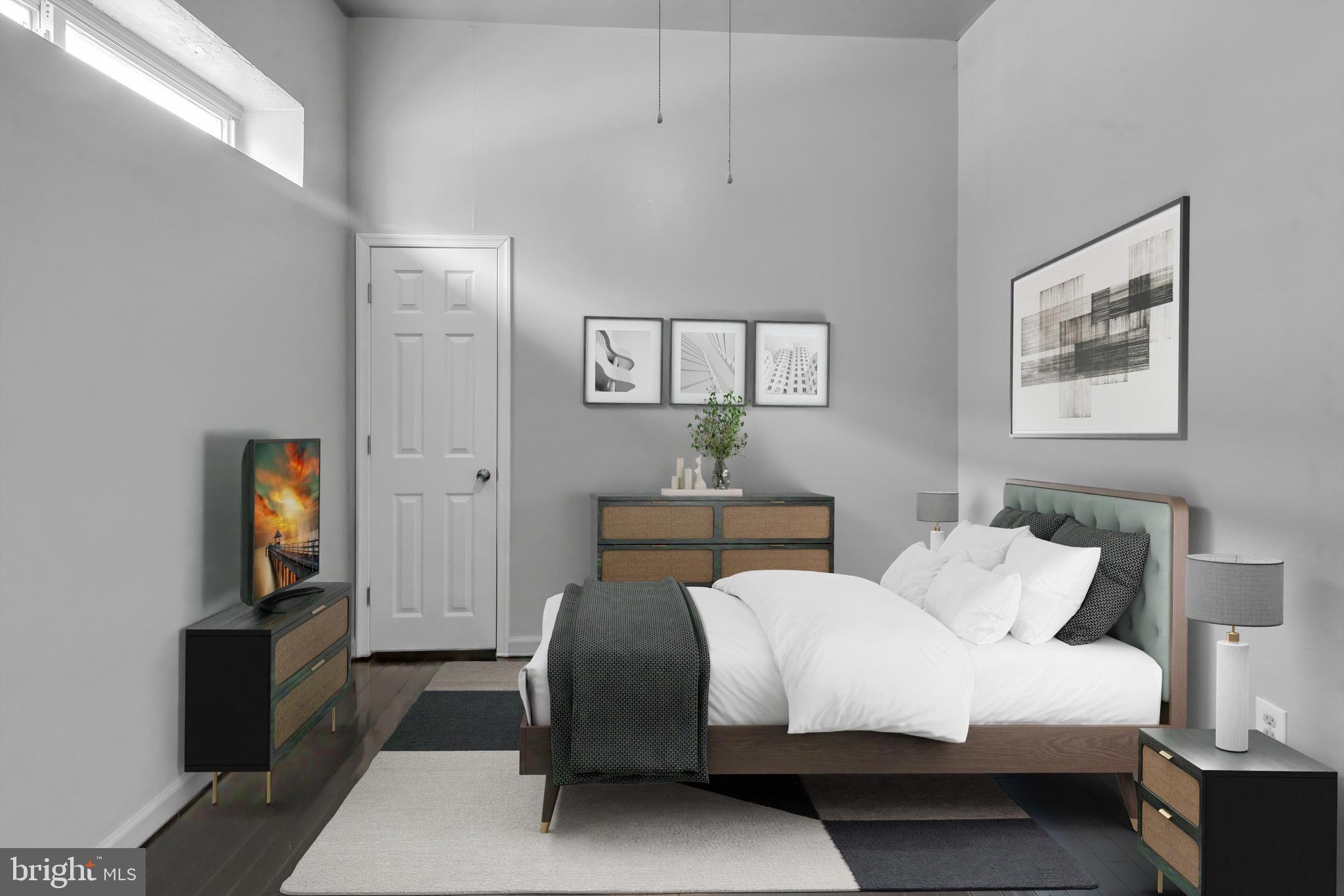 434 South 56th Street, Unit A Philadelphia, PA 19143 - Photo 5 of 19 a bedroom with a bed and a tv