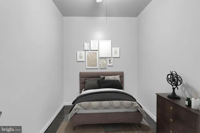 a bedroom with a bed and window