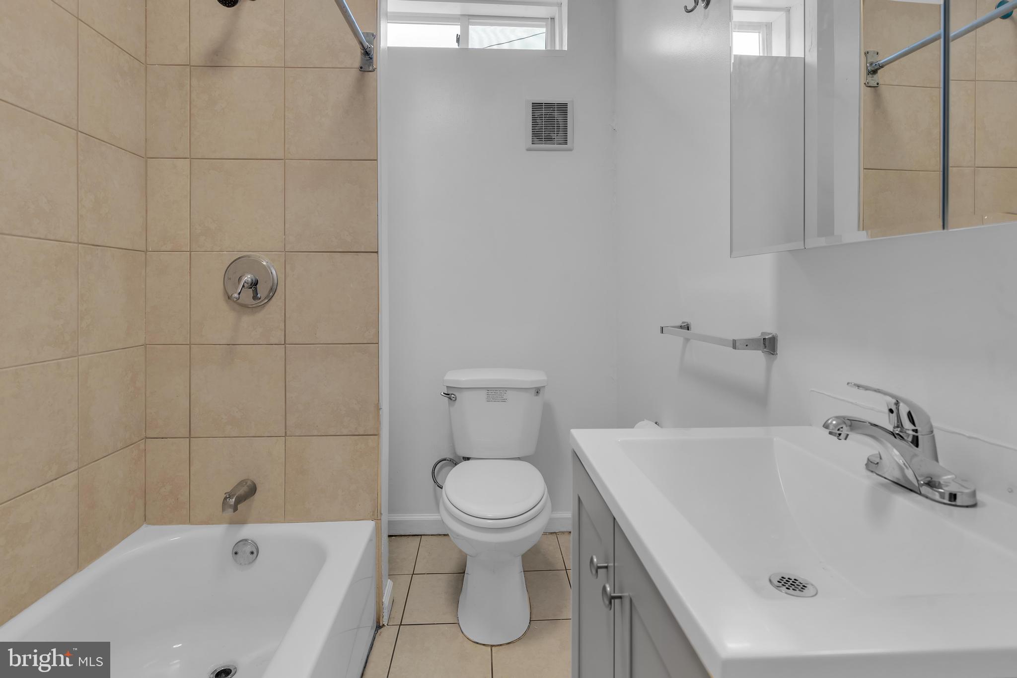 434 South 56th Street, Unit A Philadelphia, PA 19143 - Photo 7 of 19 a bathroom with a bathtub and a toilet