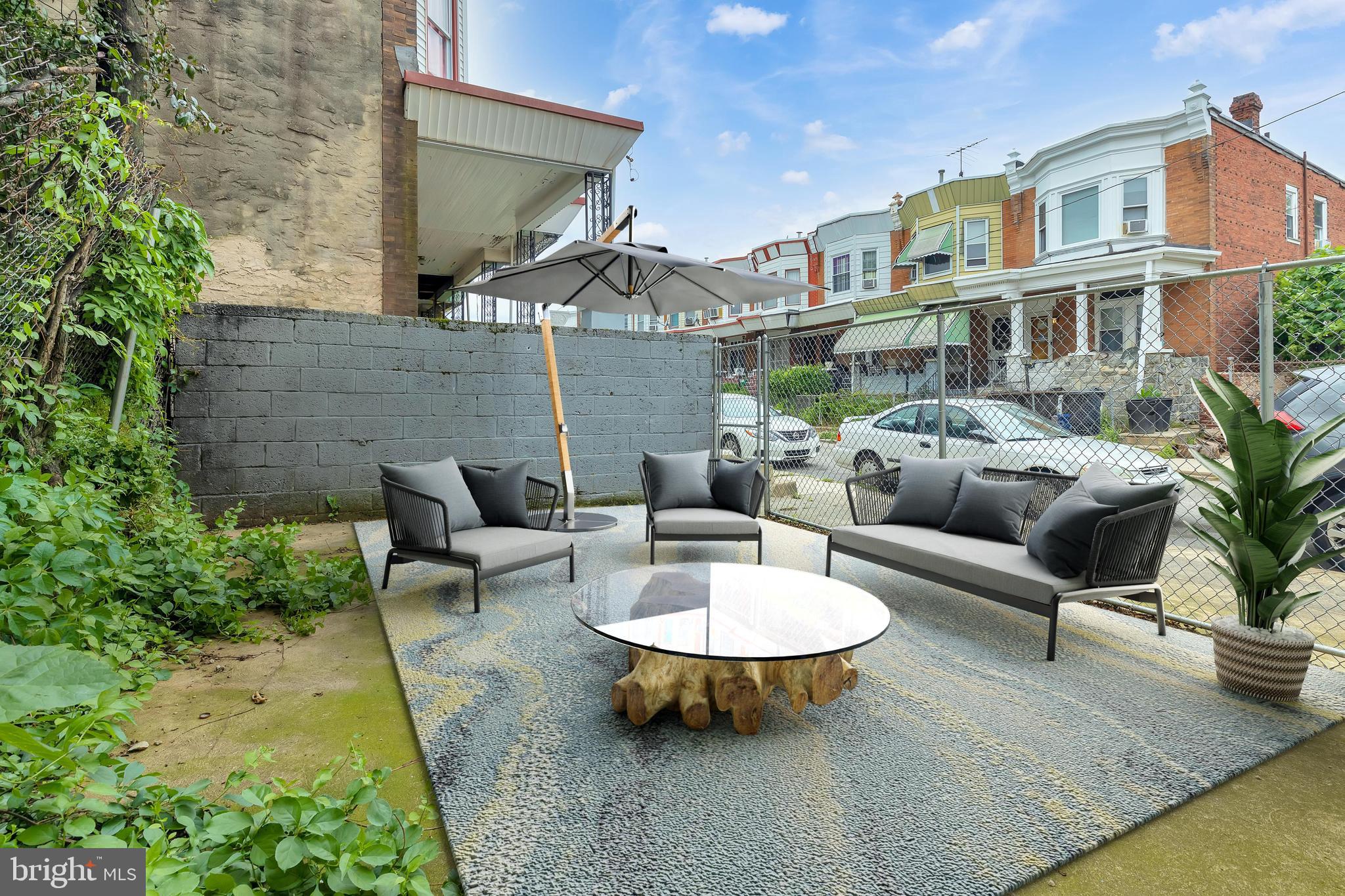 434 South 56th Street, Unit A Philadelphia, PA 19143 - Photo 9 of 19 a view of a patio with couches table and chairs