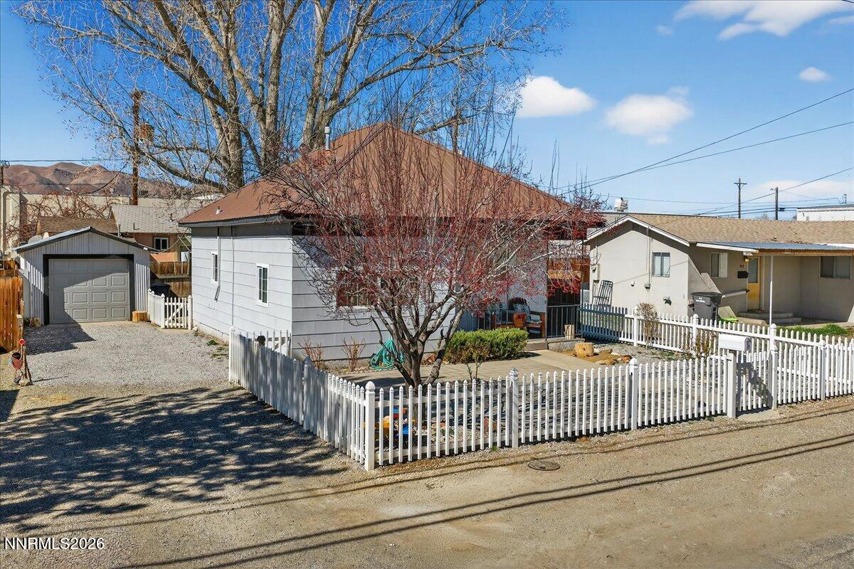 317 South Center Street Yerington, NV 89447 - Photo 1 of 27 a view of a house with wooden fence