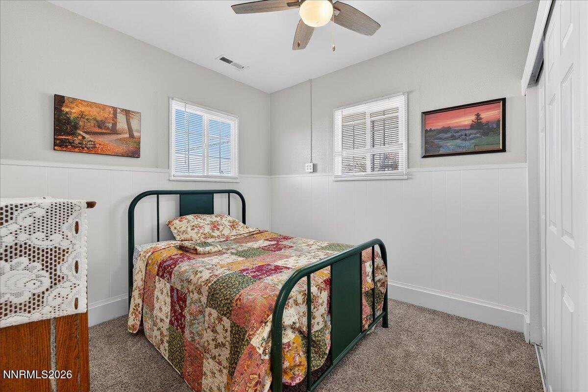 317 South Center Street Yerington, NV 89447 - Photo 13 of 27 a bedroom with a bed and a large window