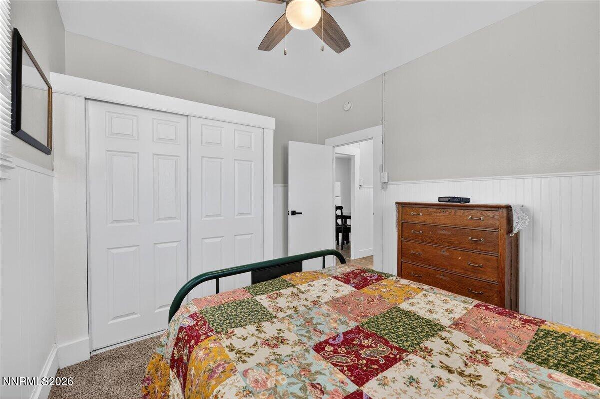 317 South Center Street Yerington, NV 89447 - Photo 14 of 27 a bedroom with a bed and a dresser