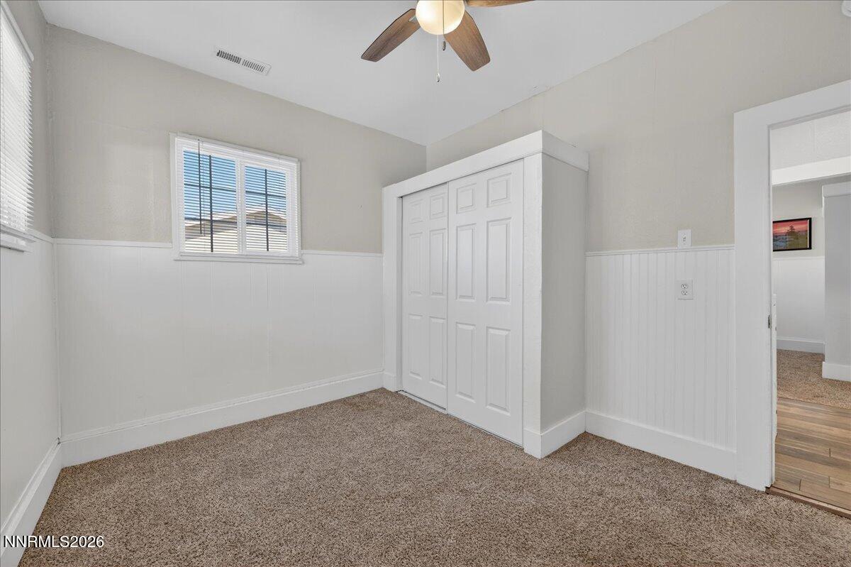 317 South Center Street Yerington, NV 89447 - Photo 17 of 27 an empty room with chandelier fan