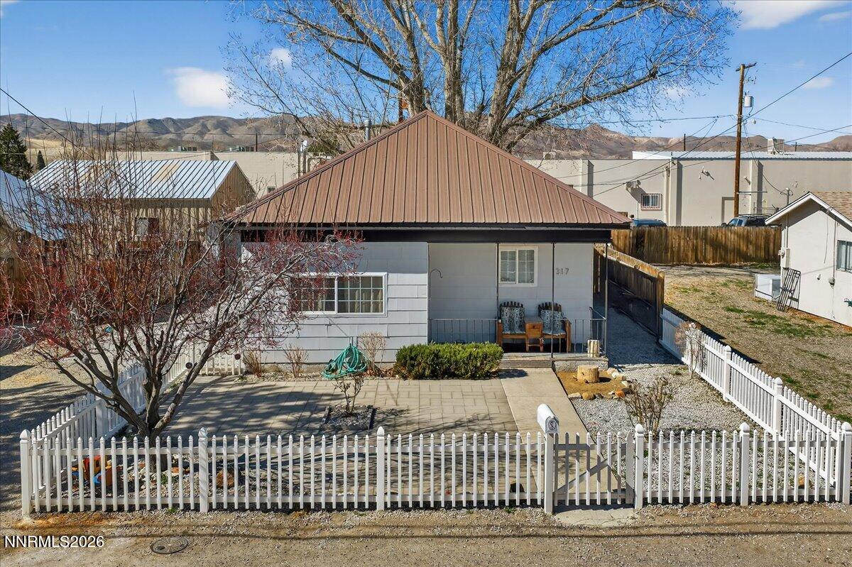 317 South Center Street Yerington, NV 89447 - Photo 2 of 27 a front view of a house with a yard
