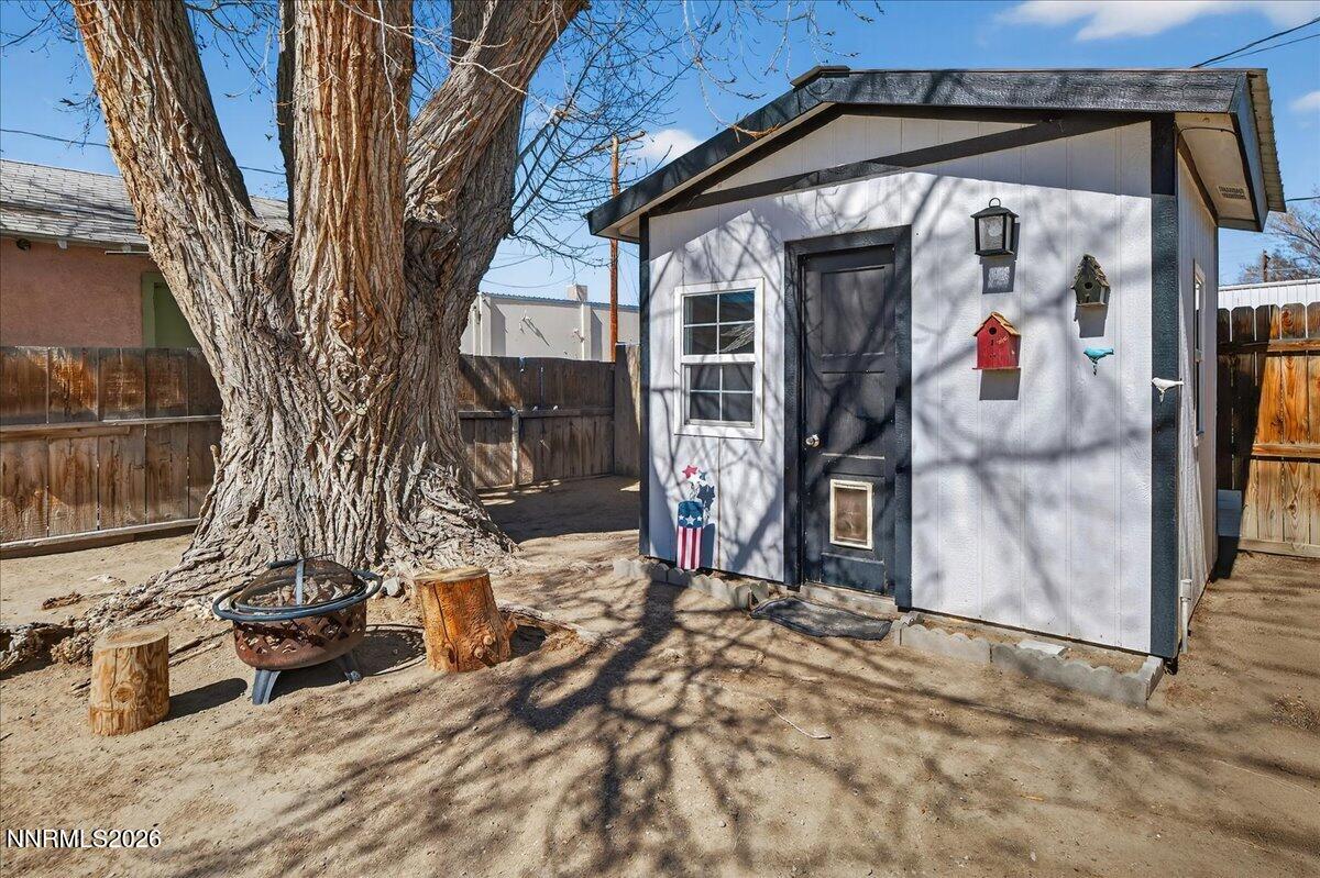 317 South Center Street Yerington, NV 89447 - Photo 21 of 27 a view of a house with a snow on the wall and a car parked