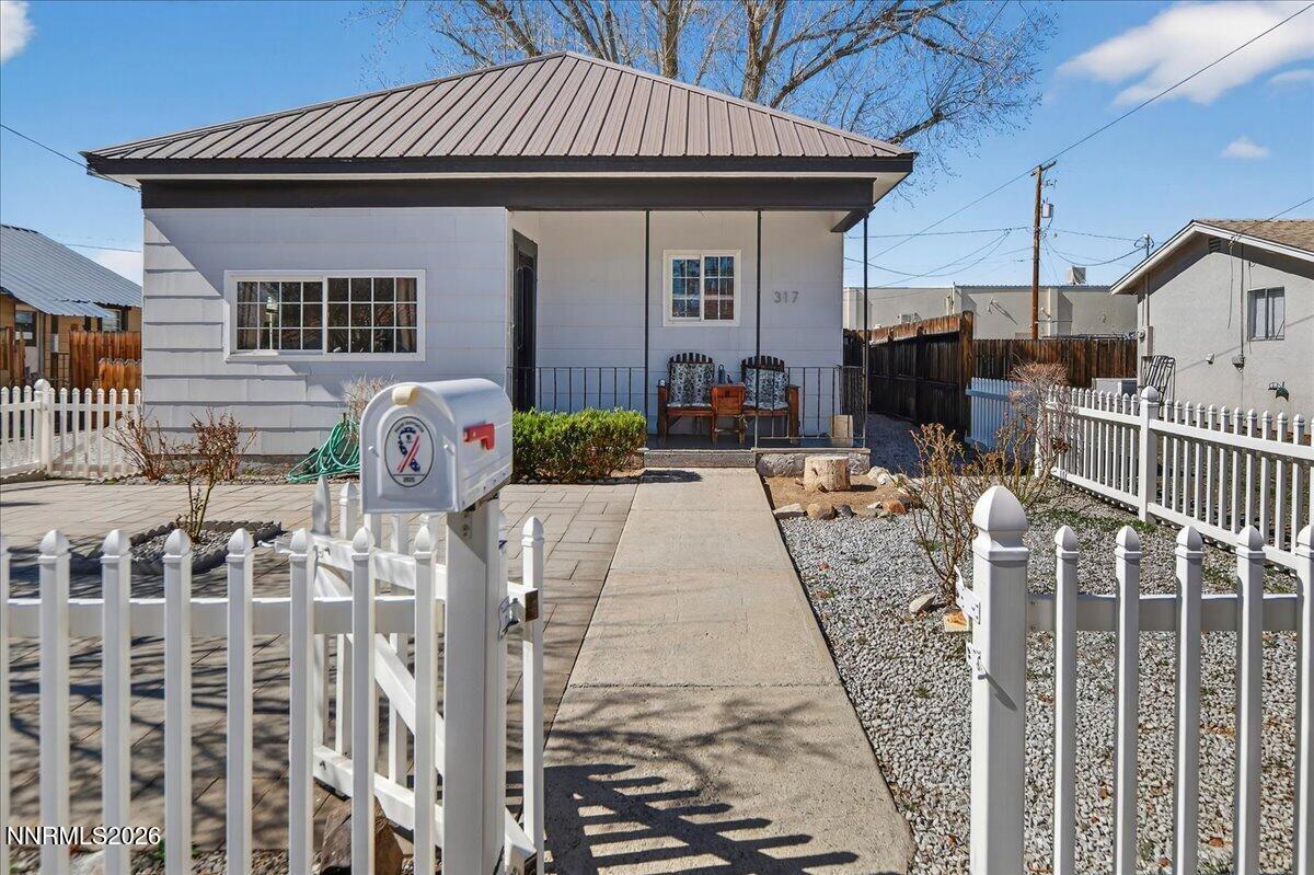 317 South Center Street Yerington, NV 89447 - Photo 4 of 27 a front view of a house with glass doors