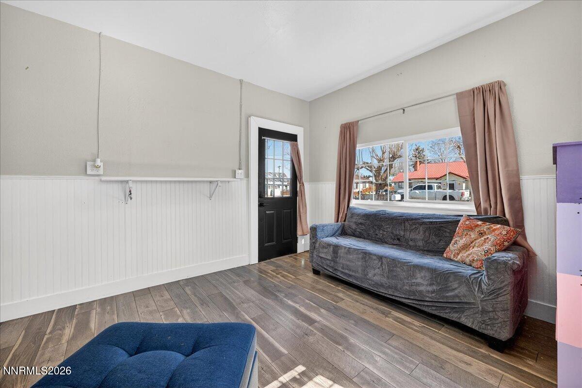 317 South Center Street Yerington, NV 89447 - Photo 6 of 27 a living room with furniture and a painting on the wall