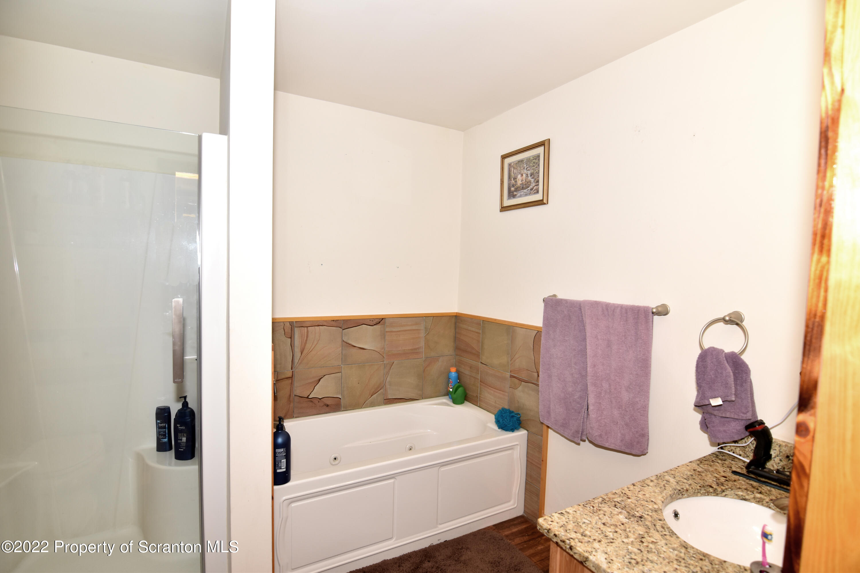 209 Oliver Road Meshoppen, PA 18630 - Photo 12 of 24 a bathroom with a tub sink and mirror