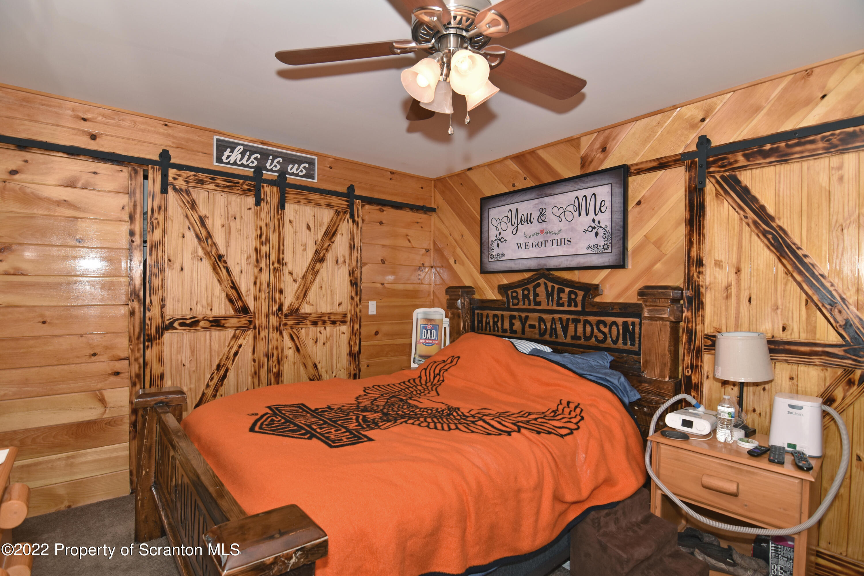 209 Oliver Road Meshoppen, PA 18630 - Photo 16 of 24 a bedroom with a bed and a chandelier