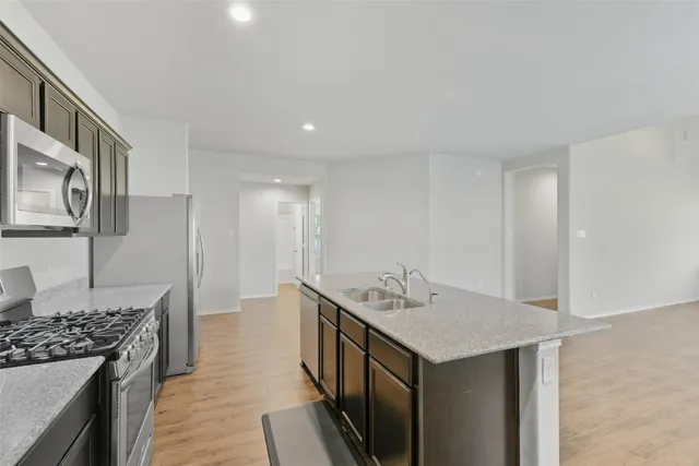 a kitchen with a sink and stove