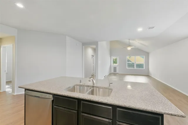a bathroom with a sink double vanity and a mirror