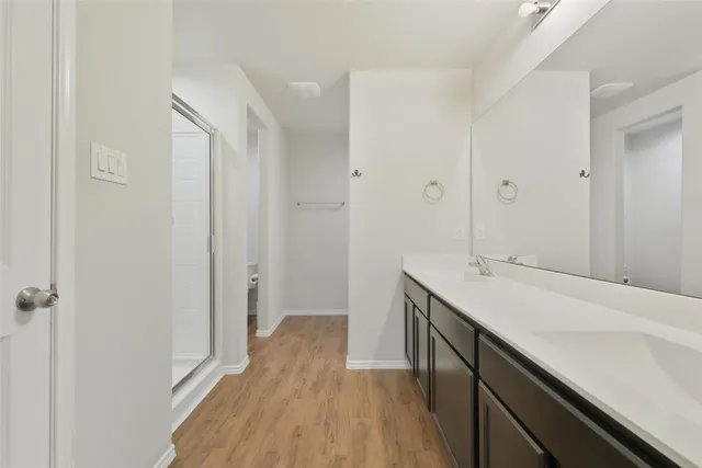 a bathroom with a sink and mirror