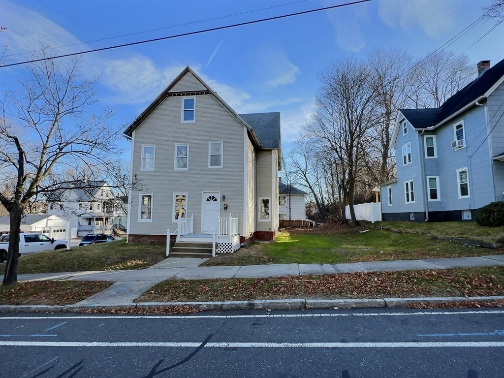 83 Oak Street Springfield, MA 01151 - Photo 18 of 18 a front view of a house with a yard