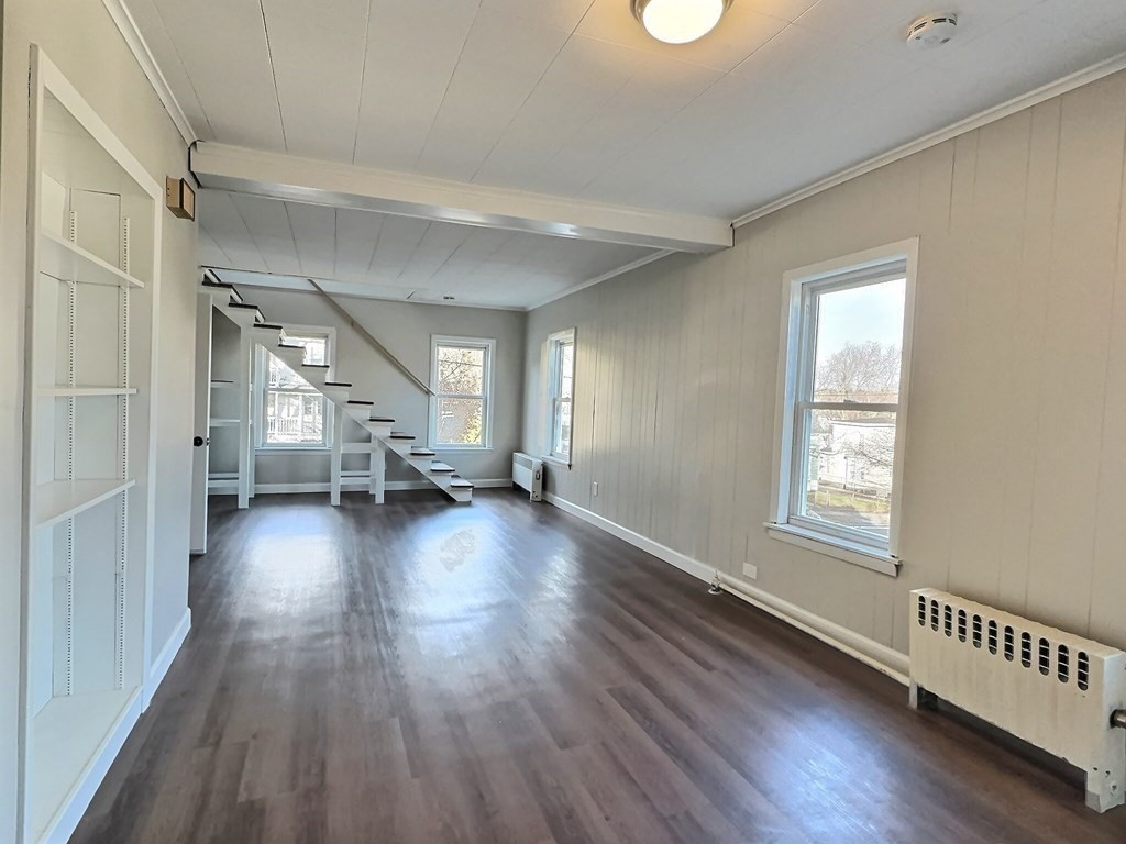 83 Oak Street Springfield, MA 01151 - Photo 4 of 18 a view of a livingroom with wooden floor