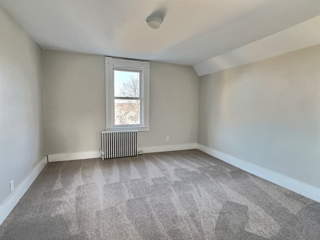 83 Oak Street Springfield, MA 01151 - Photo 8 of 18 an empty room with a window