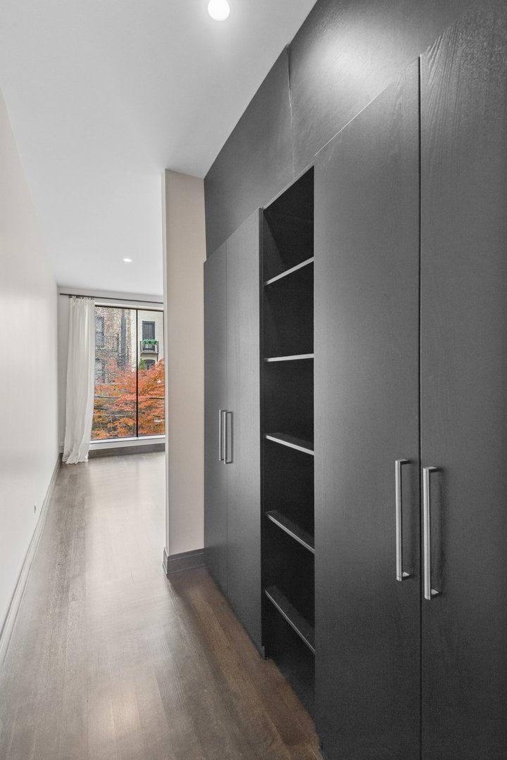 44 East Cedar Street Chicago, IL 60611 - Photo 18 of 35 a view of empty room with wooden floor and window