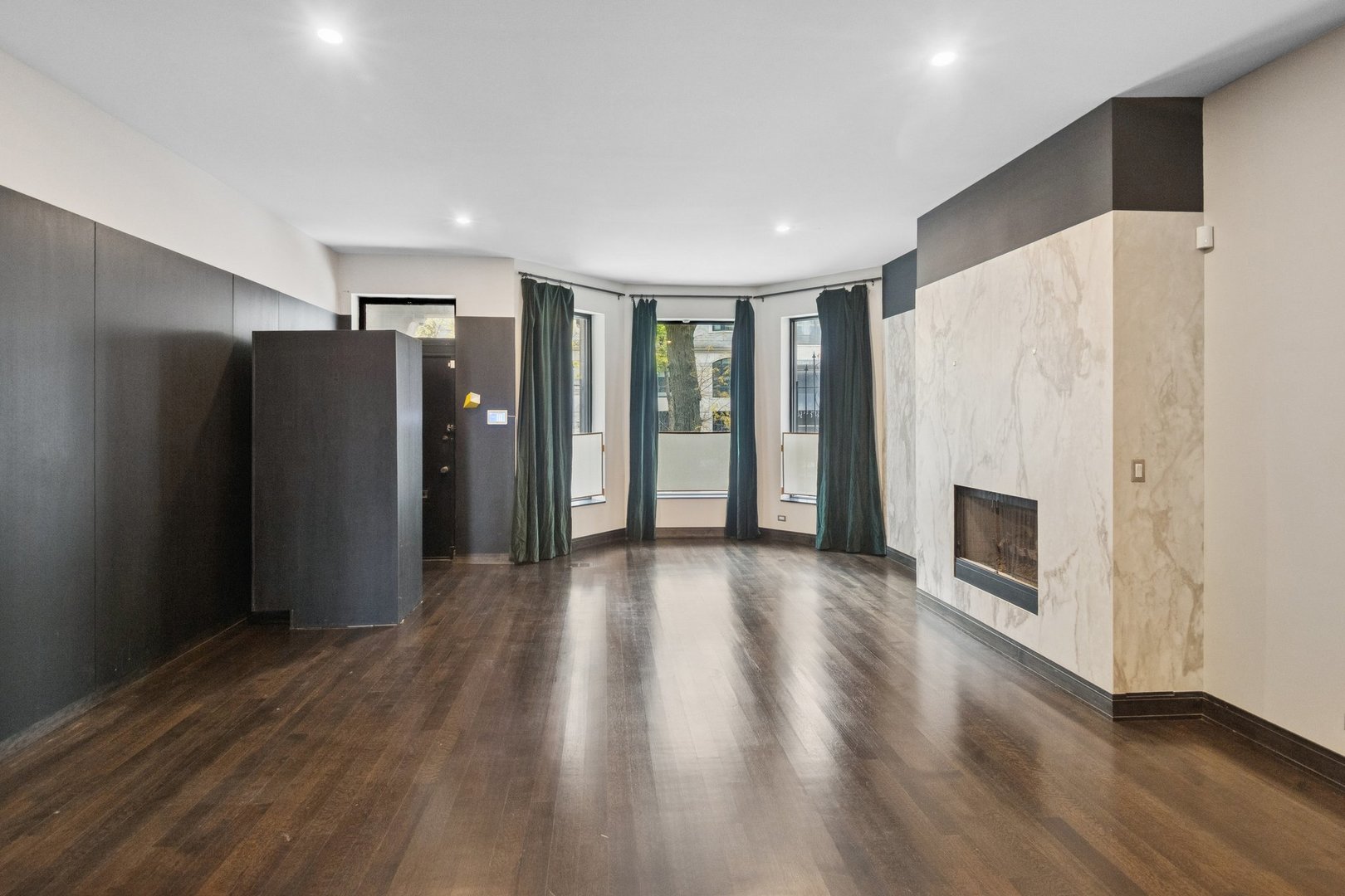 44 East Cedar Street Chicago, IL 60611 - Photo 2 of 35 a view of a livingroom with a fireplace wooden floor and window