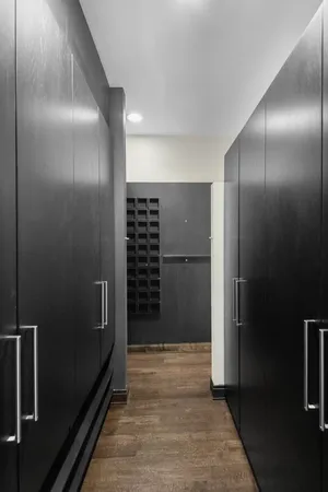 a room with a wooden floor and furniture