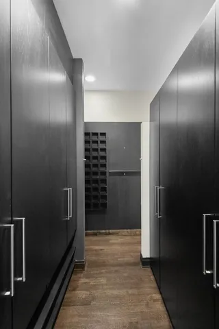 a room with a wooden floor and furniture