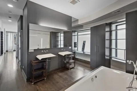 a room with a table chairs and wooden floor