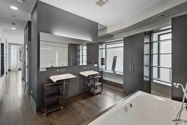 a room with a table chairs and wooden floor