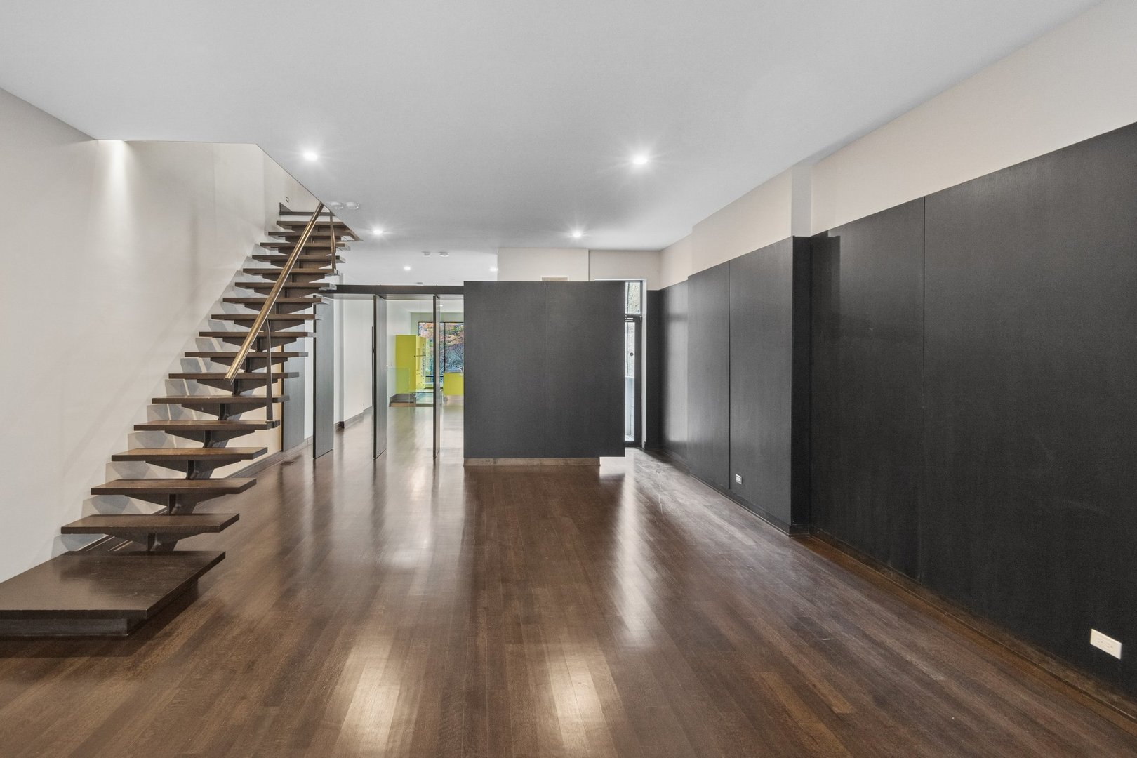 44 East Cedar Street Chicago, IL 60611 - Photo 5 of 35 a view of an empty room with wooden floor