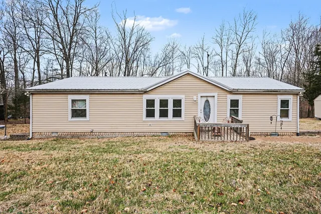 a house with trees in the background
