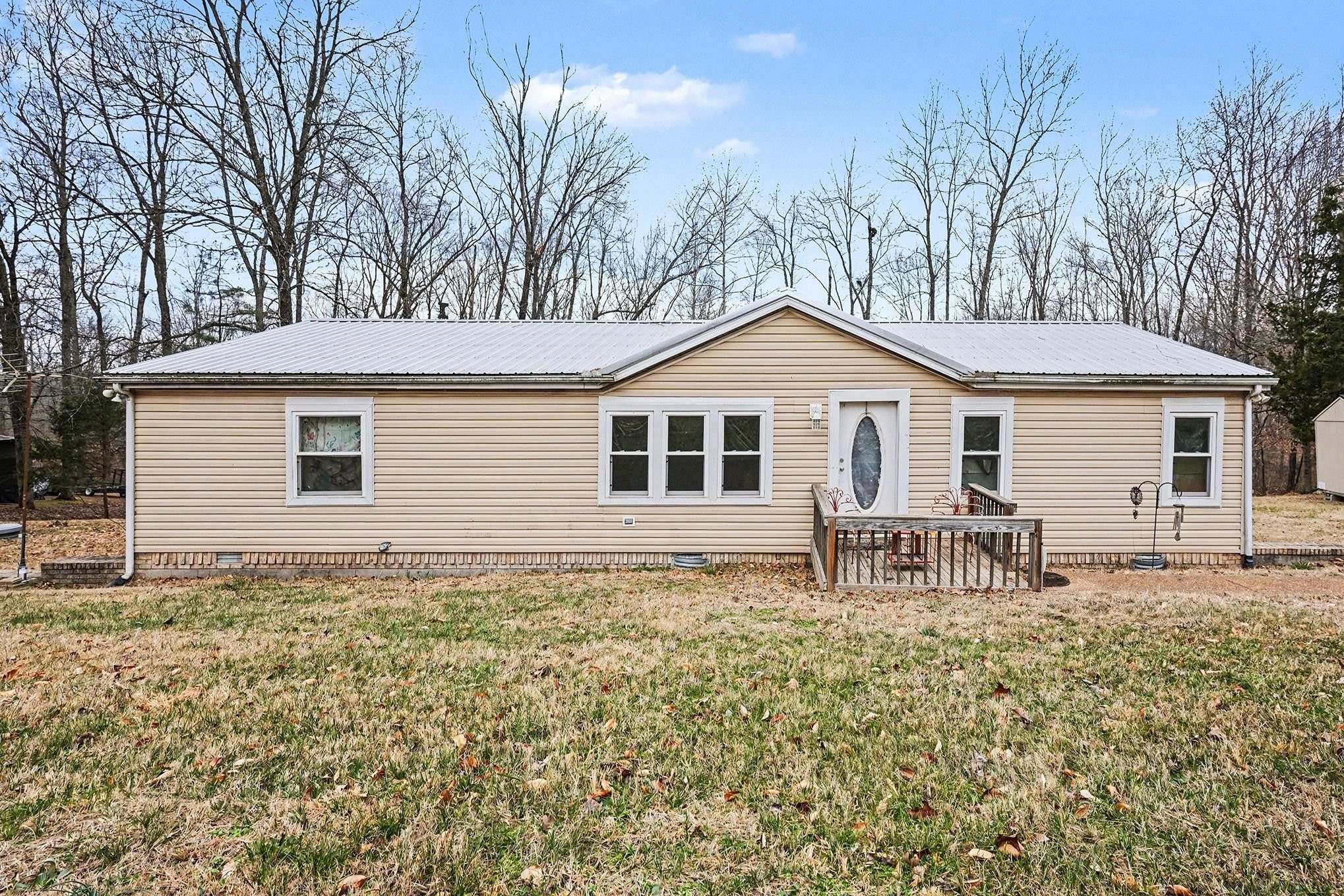 a house with trees in the background