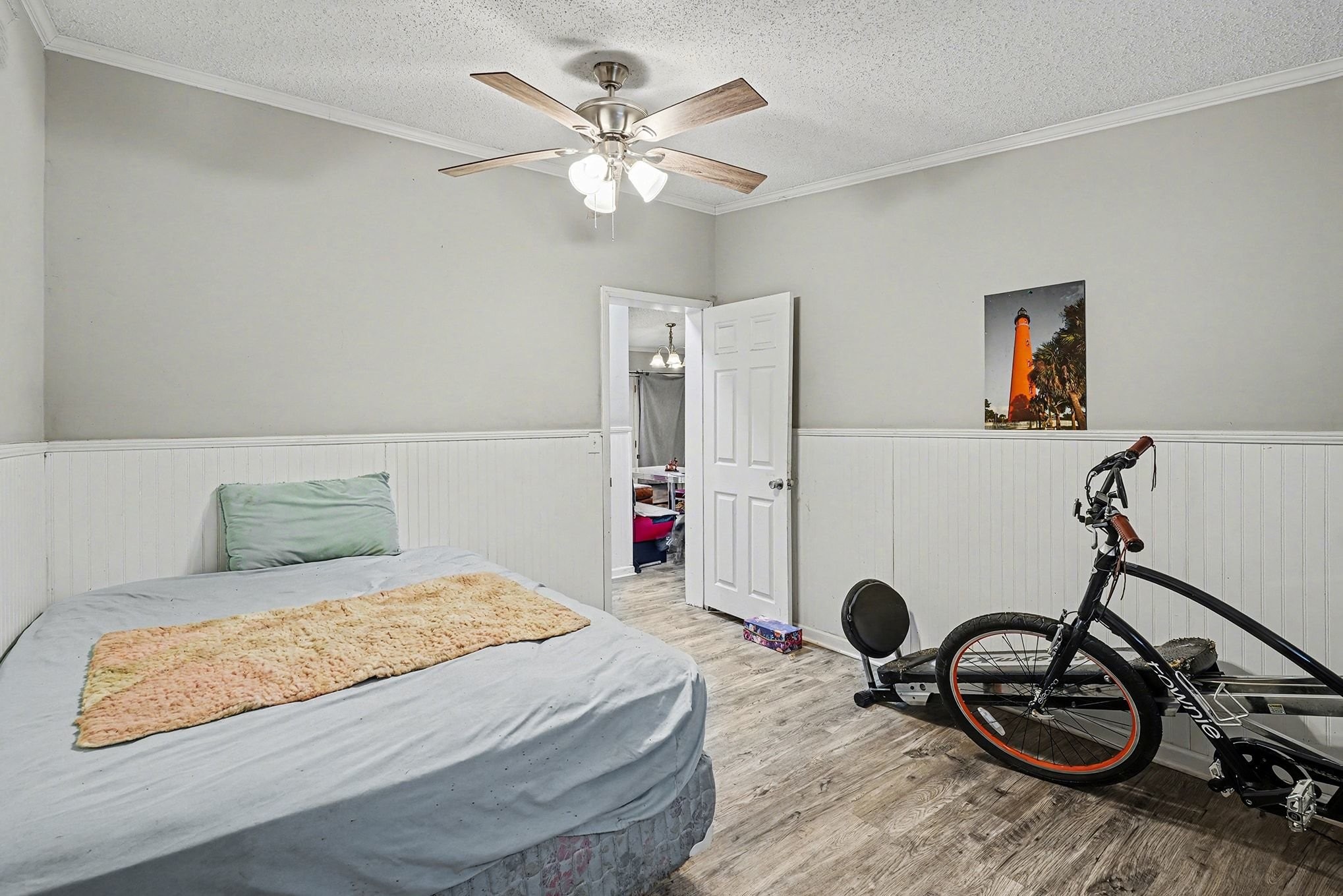 8896 Greer Road Lyles, TN 37098 - Photo 17 of 30 a bedroom with a bed and a table with wooden floor