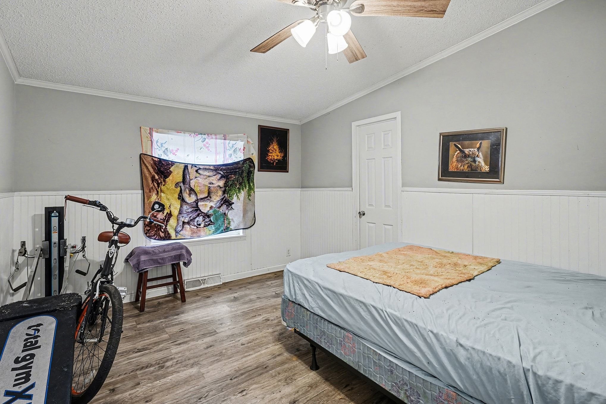 8896 Greer Road Lyles, TN 37098 - Photo 18 of 30 a bedroom with a bed and wooden floor