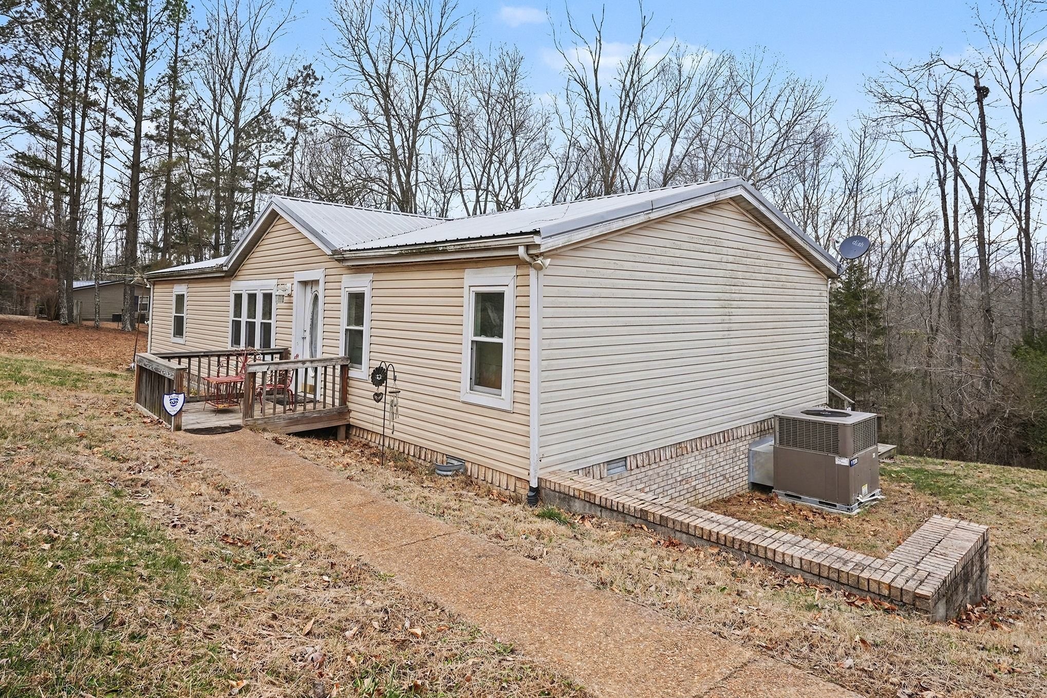 8896 Greer Road Lyles, TN 37098 - Photo 2 of 30 a view of a house with a yard and roof