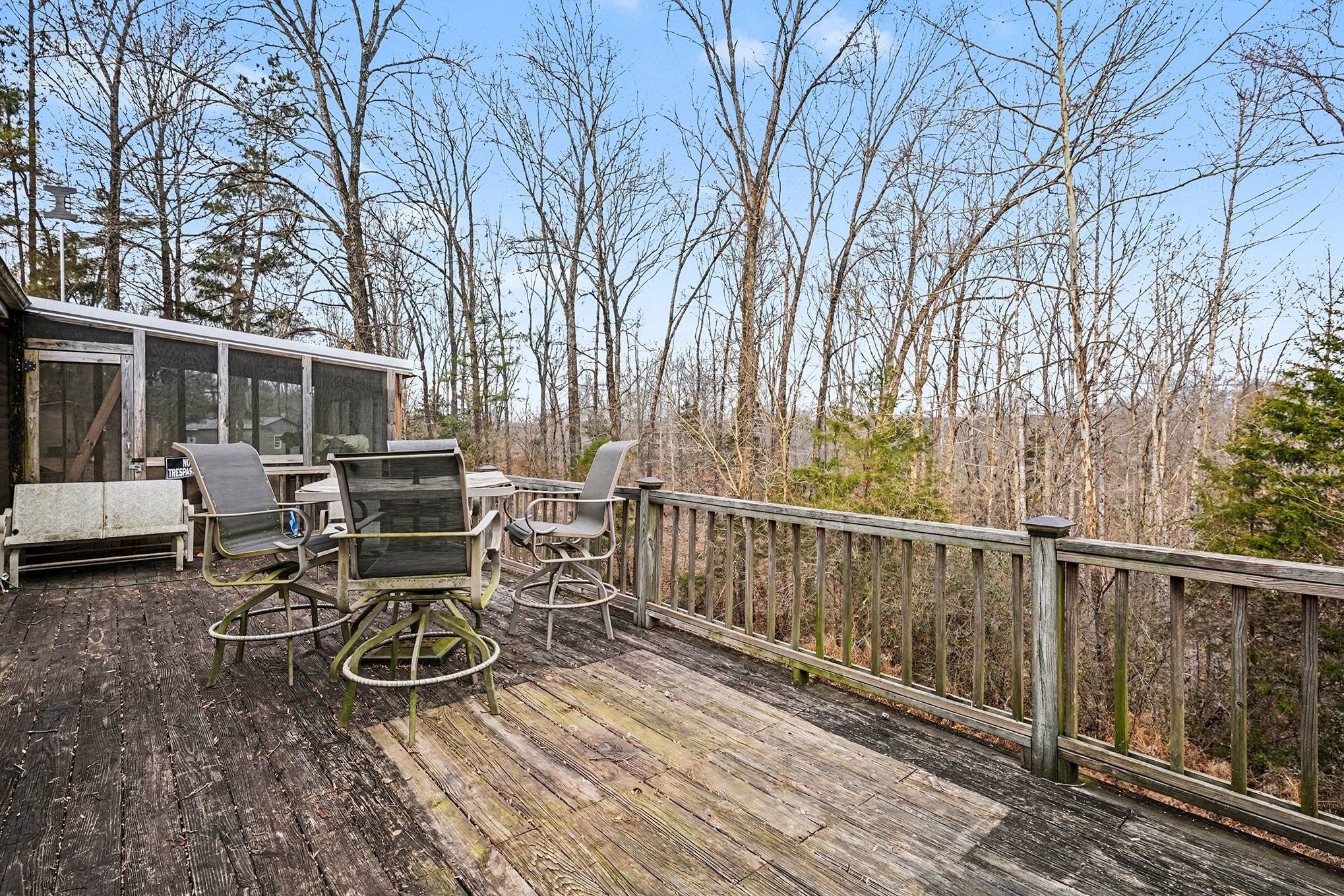 8896 Greer Road Lyles, TN 37098 - Photo 28 of 30 a view of a patio with table and chairs and wooden floor