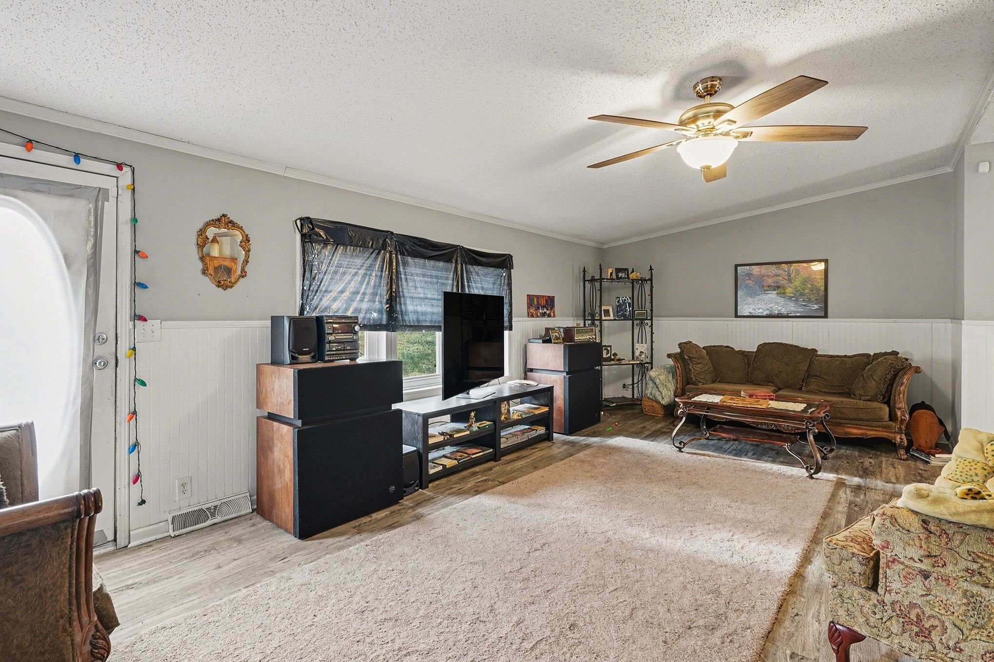 8896 Greer Road Lyles, TN 37098 - Photo 4 of 30 a living room with furniture and a flat screen tv
