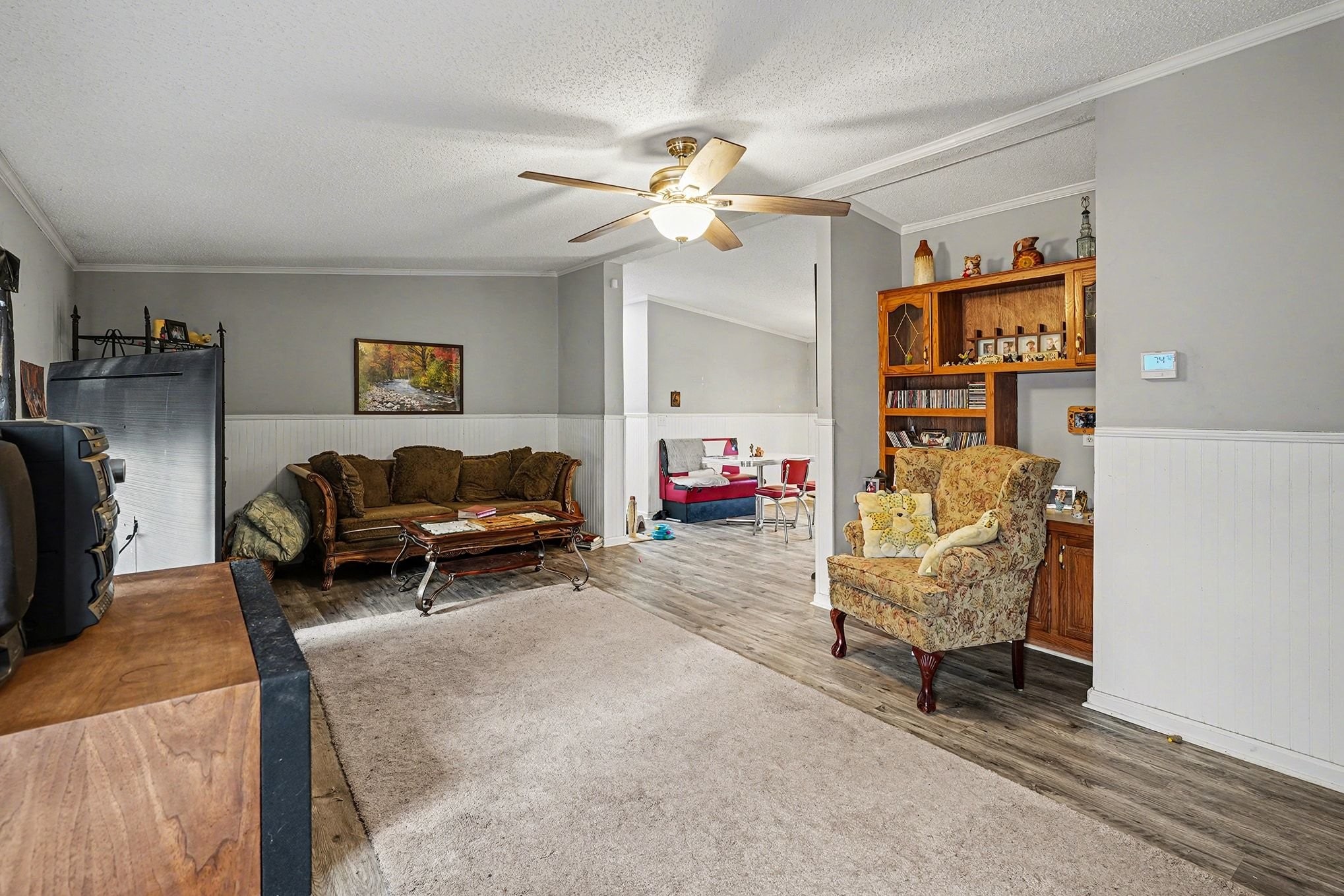 8896 Greer Road Lyles, TN 37098 - Photo 5 of 30 a living room with furniture and a chandelier