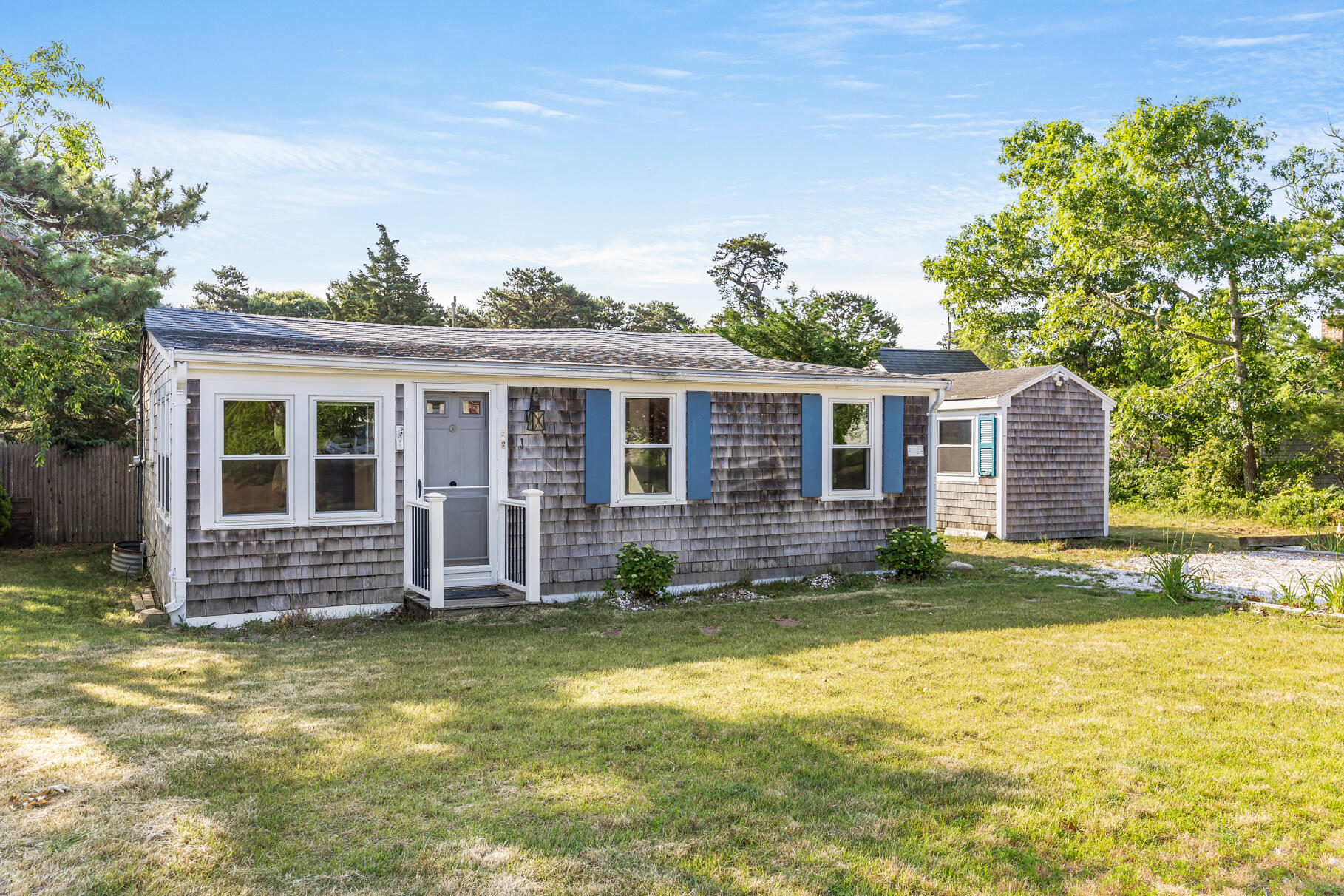 front view of a house with a yard