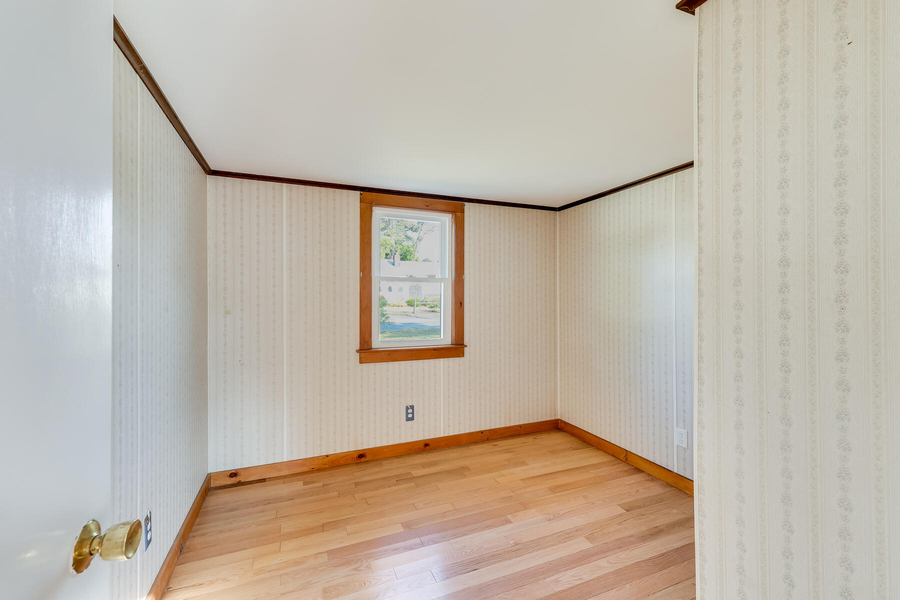 12 Wixon Road Dennis Port, MA 02639 - Photo 26 of 32 a view of an empty room with wooden floor and a window