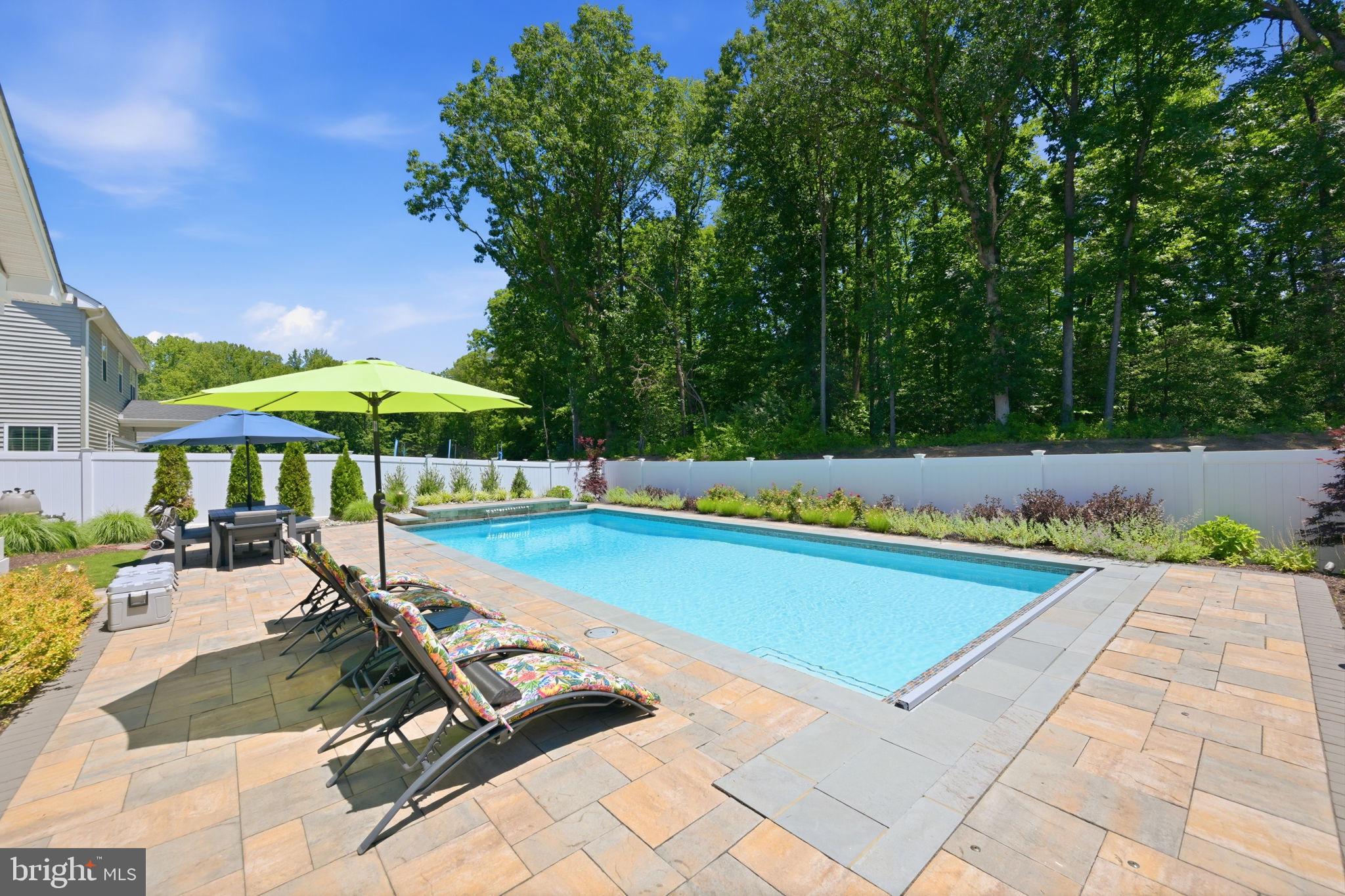 1321 Upper Patuxent Ridge Road Odenton, MD 21113 - Photo 19 of 48 Serene poolside retreat in nature.