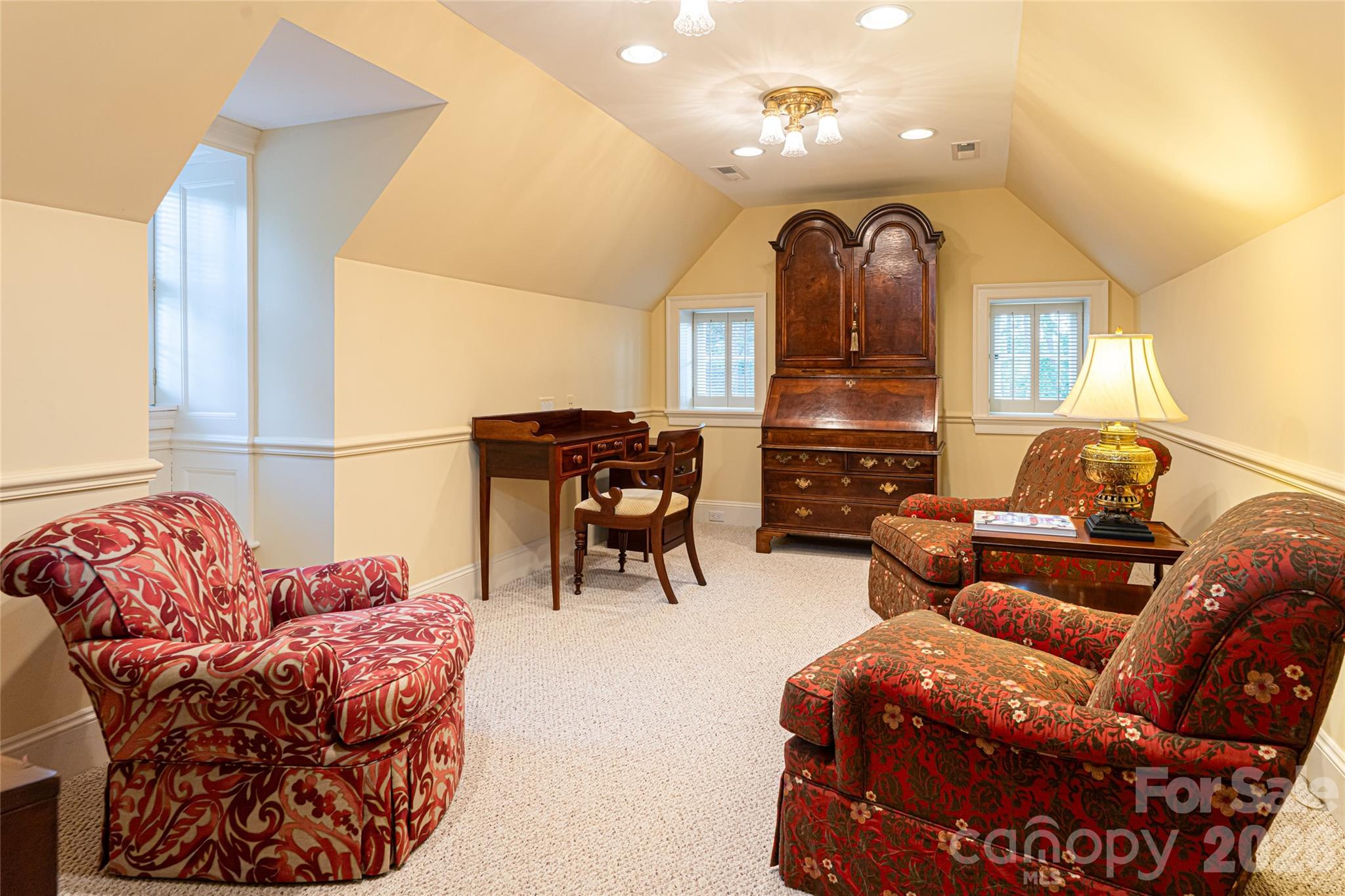 324 Vanderbilt Road Asheville, NC 28803 - Photo 38 of 48 a living room with furniture a fireplace and a chandelier