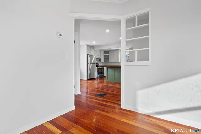 a view of a kitchen from the hallway