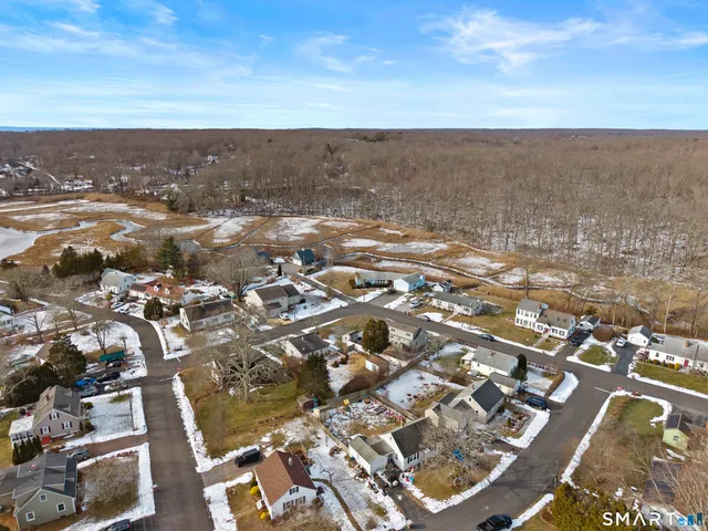 an aerial view of residential building and parking space