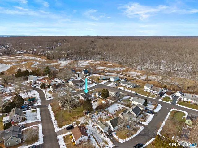 an aerial view of residential building and parking space