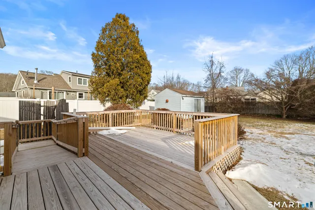 a view of a balcony with wooden floor