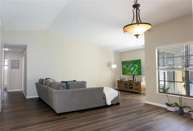 a kitchen with a sink cabinets stainless steel appliances and a window