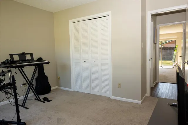 a bathroom with a toilet and a shower curtain