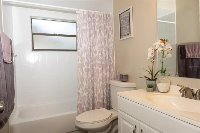 a bathroom with a sink a mirror and shower