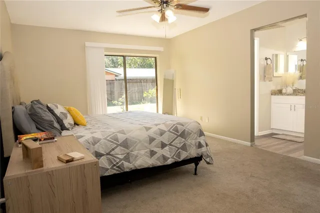 a vase of flowers sitting on a window sill and a window
