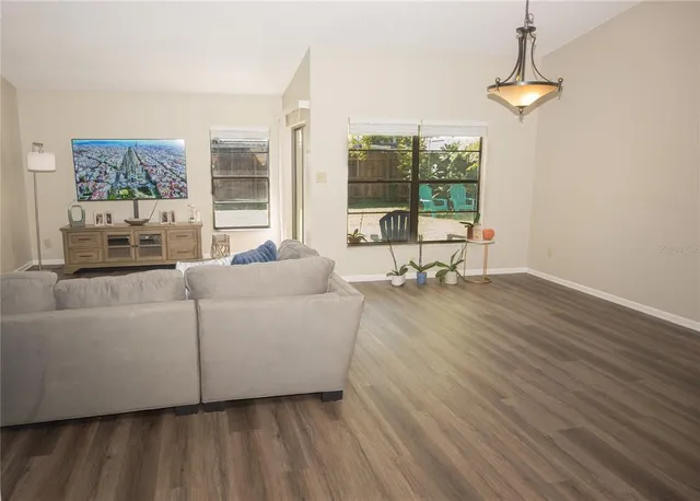 a kitchen with a refrigerator and a sink