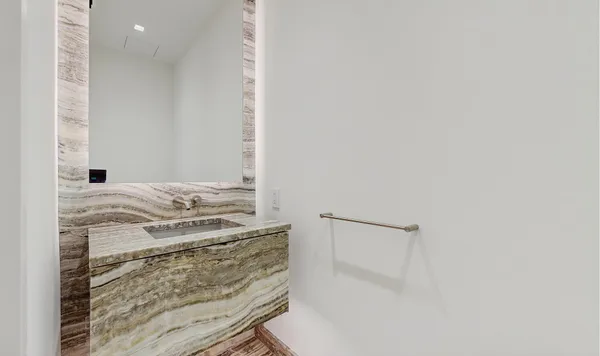 a bathroom with a double vanity sink and mirror