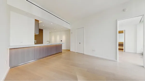 a view of balcony with wooden floor and outdoor seating